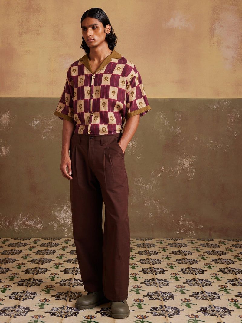 Geometric checkered resort shirt with chocolate wide-leg trousers
