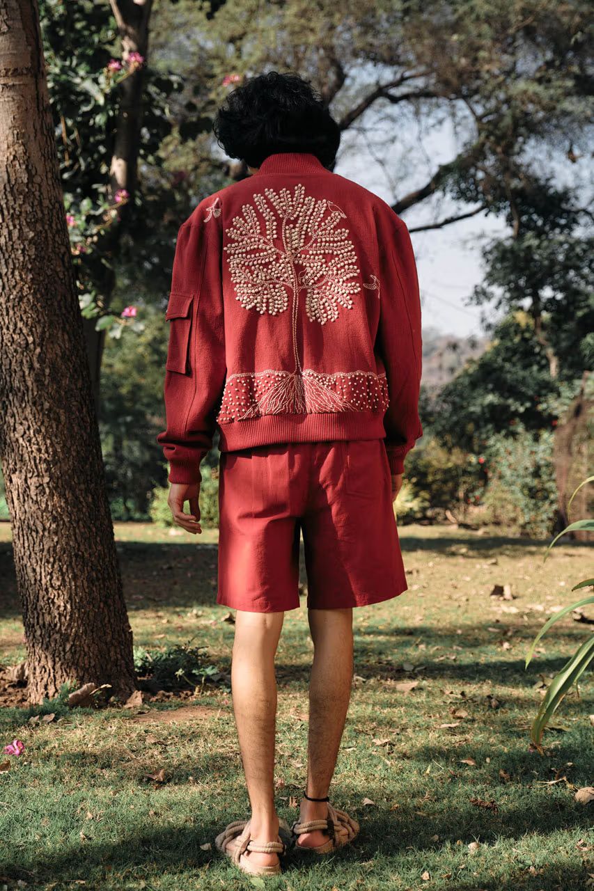 Terracotta resort bomber jacket with hand-embroidered Kalpavriksha tree motif