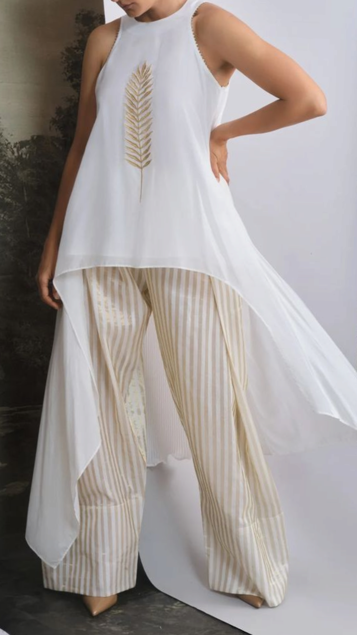 Butter signature asymmetric halter tunic with striped palazzo